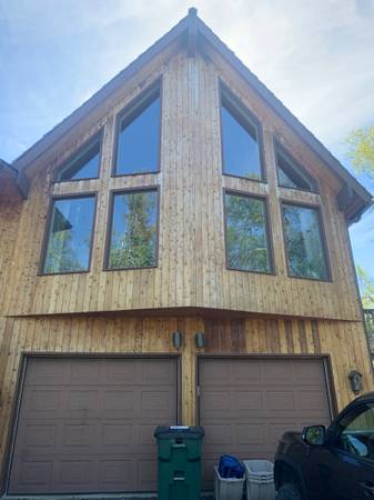 Exterior home with multiple newly installed replacement windows